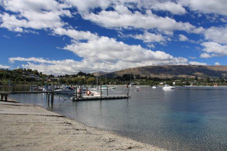 Photo for New Zealand landscape - Lake Wanaka pebbly beach and harbor. - Royalty Free Image