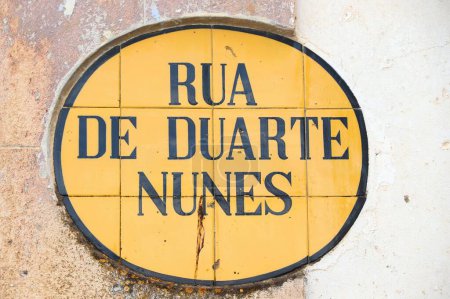 Evora architecture detail in Portugal. Street sign with street name: Rua de Duarte Nunes.