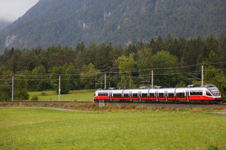 Photo for CARINTHIA, AUSTRIA - AUGUST 7, 2022: Bombardier Talent passenger train of Austrian Federal Railways OBB traveling in Carinthia, Austria. - Royalty Free Image