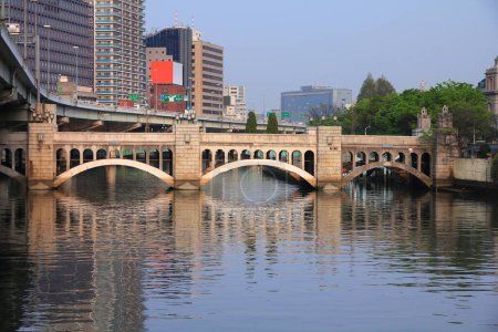Photo for Osaka city, Japan. Cityscape with historic Suishobashi Bridge. Dojima River. - Royalty Free Image