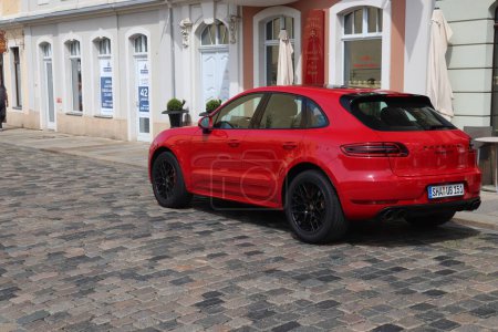 Photo for DRESDEN, GERMANY - MAY 10, 2018: Porsche Macan luxury crossover SUV car parked in Germany. There were 45.8 million cars registered in Germany (as of 2017). - Royalty Free Image