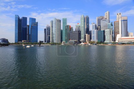 Singapore City downtown core skyline seen across Marina Bay. Modern city view.