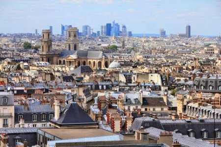 Paris city skyline with 6th Arrondissement, Odeon neighborhood and La Defense district in background.