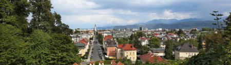 Klagenfurt city panorama in Austria. Karawanks Alps range in background.