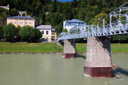 Salzburg, Austria. Salzach river footbridge Mozartsteg and Kapuzinerberg hill.