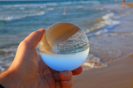 Beach vibes in Haifa, Israel. Glass sphere reflection of Dado Beach in Haifa.