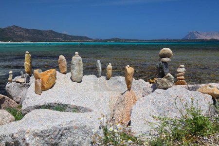 La Cinta beach stone cairns in Sardinia, Italy. Costa Smeralda region in Sardinia island.