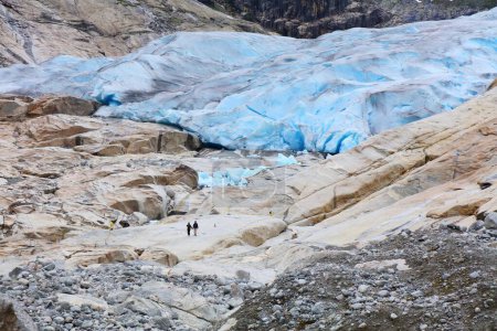 Norway nature. Glacier landscape. Jostedalsbreen National Park - Nigardsbreen Glacier. Very small people for scale.
