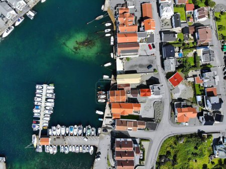 Norway Karmoy island drone view. Akrehamn boat harbor town aerial view.