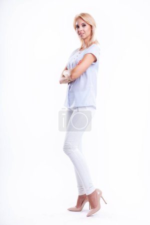 Photo for Silhouette attractive pretty blonde woman in blue shirt isolated on white background - Royalty Free Image