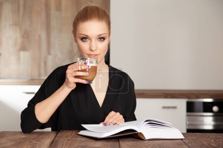 Photo for Portrait of attractive young pretty blonde student girl reading book - Royalty Free Image