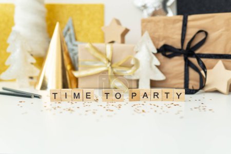 Photo for Christmas party time - confetti, gifts, tree, stars, glitter, ribbon. Party time lettering. New year 2023 2024 - Royalty Free Image