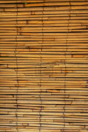 Close-up of a stacked bamboo mat, highlighting natural patterns and warm tones