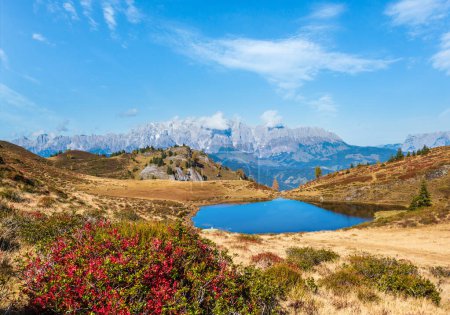 Photo for Autumn alpine Kleiner Paarsee or Paarseen lake, Dorfgastein, Land Salzburg, Austria. Alps Hochkonig rocky mountain group view in far. Picturesque hiking, seasonal, and nature beauty concept scene. - Royalty Free Image