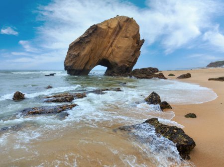 Photo for Sandy beach Praia de Santa Cruz with boulder rock formation (Portugal). Misty weather. - Royalty Free Image