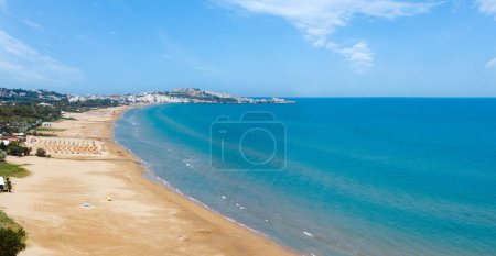 Photo for Summer Lido di Portonuovo Adriatic sea beach view (Vieste, Gargano peninsula, Puglia, Italy). People are unrecognizable. Two shots stitch panorama. - Royalty Free Image