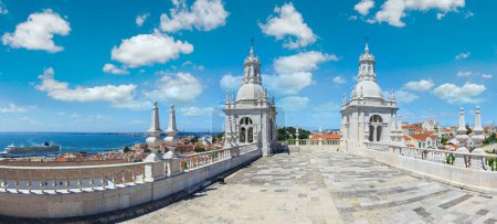 Photo for Roof with white bell towers on blue sky background. Monastery of St. Vincent Outside the Walls, or Church (Iglesia) de Sao Vicente de Fora in Lisbon, Portugal. - Royalty Free Image