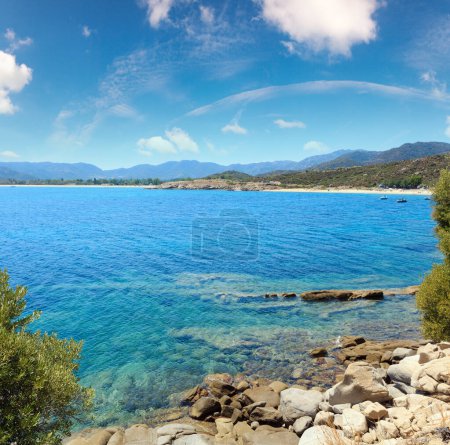 Photo for Summer sea scenery with aquamarine transparent water and sandy beach. View from shore (Sithonia, Halkidiki, Greece). - Royalty Free Image