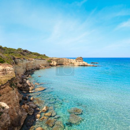 Photo for Picturesque seascape with white rocky cliffs, sea bay, islets and faraglioni at beach Spiaggia della Punticeddha, Salento Adriatic sea coast, Puglia, Italy - Royalty Free Image