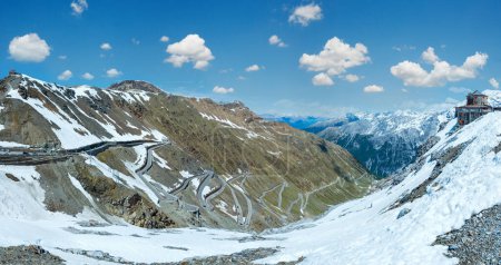 Photo for Summer Stelvio pass top with alpine road and snow on slope (Italy) - Royalty Free Image