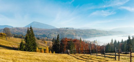 Photo for Morning fog on the slopes of the Carpathian Mountains (Yablunytsia village, Ivano-Frankivsk oblast, Ukraine). Autumn rural high-resolution panorama landscape. - Royalty Free Image