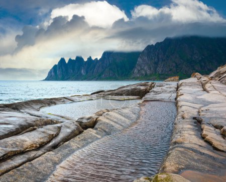 Photo for Summer night coast. The dragon's teeth rock, Jagged Ersfjord, Senja, Norway . - Royalty Free Image