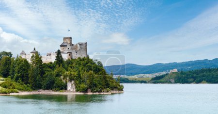 Photo for Niedzica Castle (or Dunajec Castle) summer cloudy panorama (Poland). Build between the years 1320 and 1326. And ruins of Czorsztyn Castle (on the right, 14th century) - Royalty Free Image