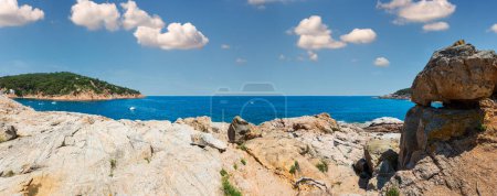 Photo for Big boulders on shore and Mediterranean sea rocky coastline summer view (near Tamariu bay, Costa Brava, Catalonia, Spain). - Royalty Free Image