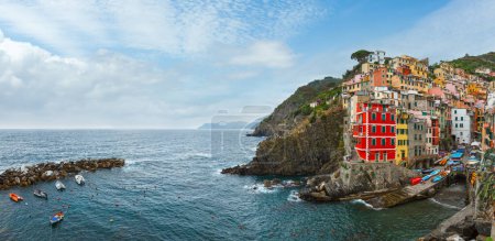 Photo for Beautiful summer Manarola - one of five famous villages of Cinque Terre National Park in Liguria, Italy. People are unrecognizable. - Royalty Free Image