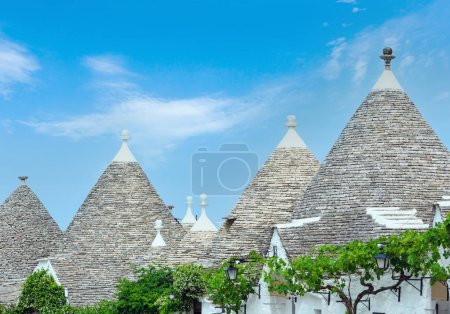 Photo for Trulli houses roofs in main touristic district of Alberobello beautiful old historic town, Apulia region, Southern Italy - Royalty Free Image