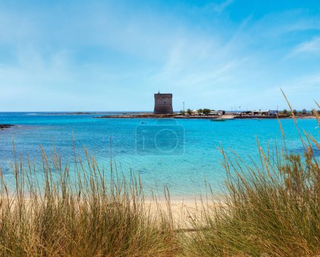 Photo for Picturesque Torre Chianca beach and historical fortification tower Torre Chianca (Torre Santo Stefano) on Salento Ionian sea coast, Porto Cesareo, Puglia, Italy - Royalty Free Image