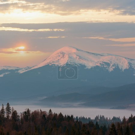 Photo for Early morning spring Carpathian mountains plateau landscape with snow-covered ridge tops in far, Ukraine. - Royalty Free Image