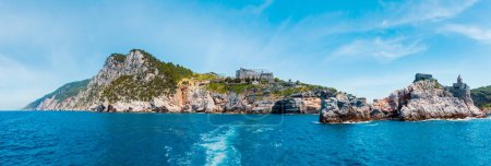 Photo for Beautiful medieval fisherman town of Portovenere (UNESCO Heritage Site) view from sea (near Cinque Terre, Liguria, Italy). Fortress Castello Doria. - Royalty Free Image