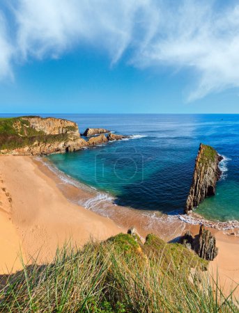 Photo for Sandy Mexota beach and pointed rock near (Spain). Atlantic Ocean coastline landscape. - Royalty Free Image