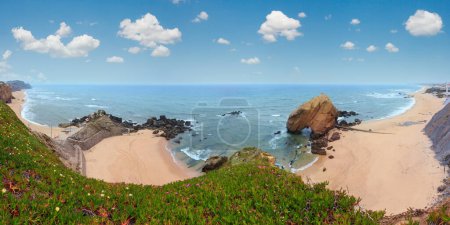Photo for Sandy beaches Praia do Guincho and Praia de Santa Cruz (Portugal). Misty weather. People are unrecognizable. Beautiful natural summer vacation travel concept. - Royalty Free Image