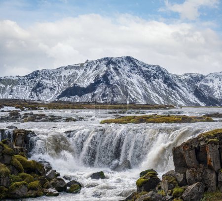 Photo for Picturesque waterfal Tungnaarfellsfoss, Iceland, panoramic autumn view  Landmannalaugar mountains under snow cover in far. - Royalty Free Image