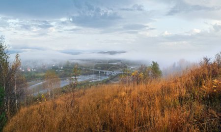 Photo for Morning fog on country foothills above Opir and Stryi rivers, and slopes of the Carpathian Mountains in far, Ukraine. - Royalty Free Image