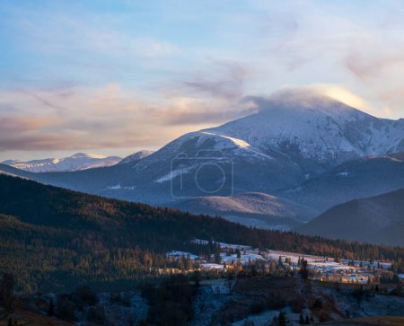 Photo for Late autumn mountain pre sunset scene with snow covered tops in far. Picturesque traveling, seasonal, nature and countryside beauty concept scene. Carpathians, Ukraine. - Royalty Free Image