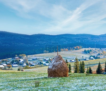 Photo for First winter snow on October Carpathian mountain plateau with village and highway far away - Royalty Free Image