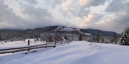Photo for Countryside hills, groves and farmlands in winter remote alpine mountain village - Royalty Free Image