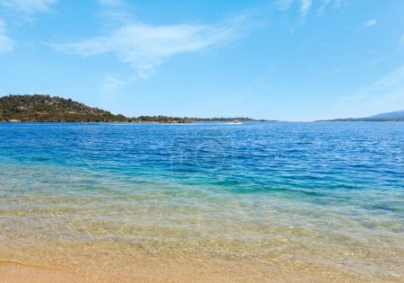 Summer Aegean sea coast landscape (Livari beach, Halkidiki, Sithonia, Greece). People are unrecognizable.