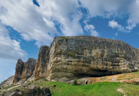 Crimea (Ukraine) mountain landscape .  In stony mountain vertical slope - ancient cave settlement (Chufut Kale, Crimea, Ukraine).