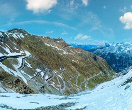 Photo for Summer Stelvio pass top with alpine road and snow on slope (Italy) - Royalty Free Image