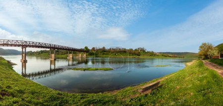 Photo for Spring picturesque panorama view of the Dnister river and old neglected wooden bridge. Nezvysko, Ternopil region, Ukraine, Europe. - Royalty Free Image