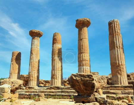 Ruined Temple of Heracles columns in famous ancient Valley of Temples, Agrigento, Sicily, Italy. UNESCO World Heritage Site.
