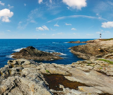 Summer ocean island Pancha coastline landscape with lighthouse (Spain).