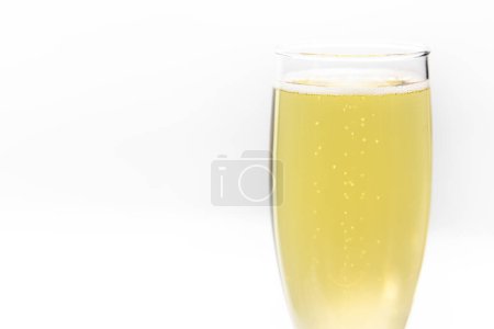 Photo for Close up of a champagne flute filled with sparkling wine isolated on a white background - Royalty Free Image