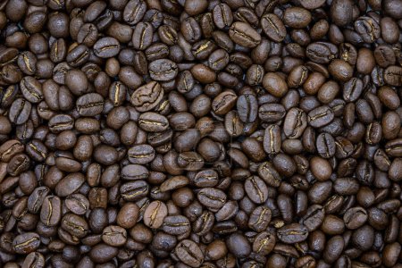Photo for Close up of a bunch of roasted coffee beans as a background - Royalty Free Image