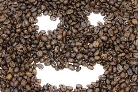 Foto de Close up of smiling a bunch of roasted coffee beans as a background - Imagen libre de derechos