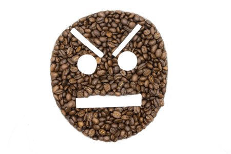 Foto de Coffee beans arranged on a white background to look like an emoji - Imagen libre de derechos